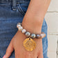 Coated Sunstone Bracelet // Tibetan Charm